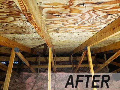 Clean attic sheathing showing natural wood grain after mold remediation